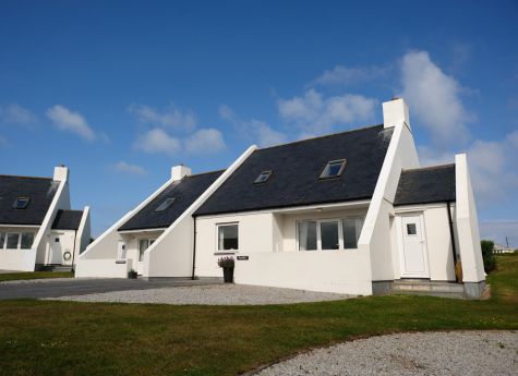 Outside the cottage Manilu on the beautiful Highcliffe Holidays grounds.