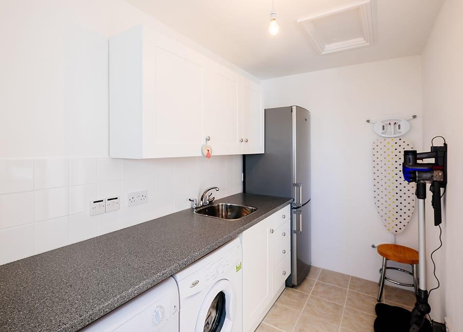 The utility room of the Highcliffe Holidays cottage Scarlett.