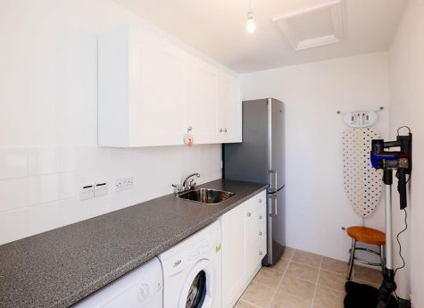 The utility room of the Highcliffe Holidays cottage Scarlett.
