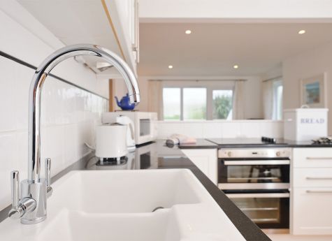 The modern kitchen in the Highcliffe Holidays' cottage Streatfeild.