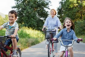 A family cycle the Camel Trail with bikes from Bridge Bike Hire.