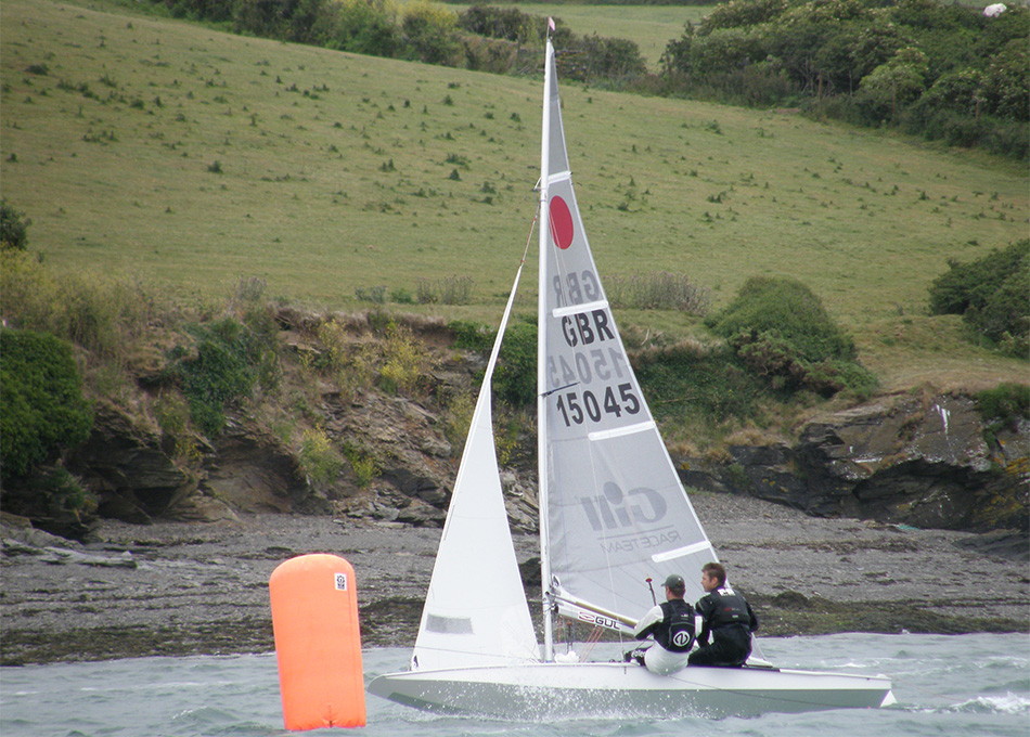 Two men sail on the River Camel with the Rock Sailing and Water Ski Club.